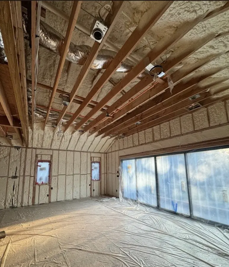 Interior walls and ceiling insulated with spray foam during new construction in Malibu